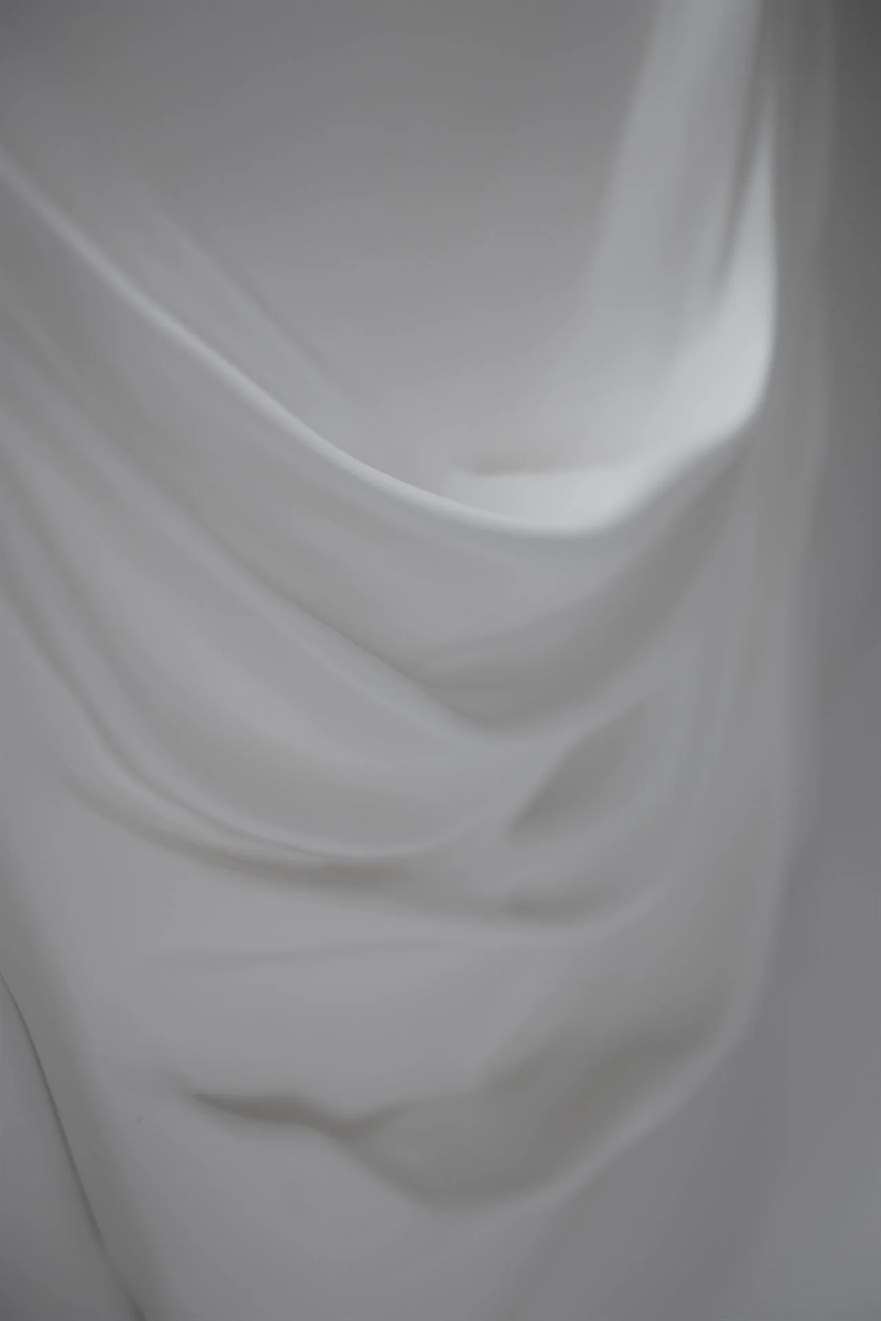 Textured wall art by Budini - fabric-soaked plaster surface detail