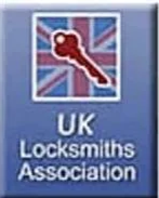 UK Locksmiths Association logo featuring a key and Union Jack flag in the background.