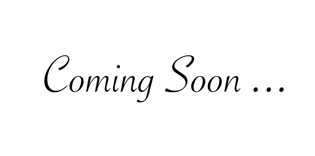 A white background with black cursive text saying 'Coming Soon...'