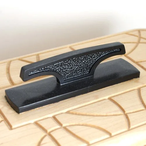 Close-up of a keepsake box handle on lid.