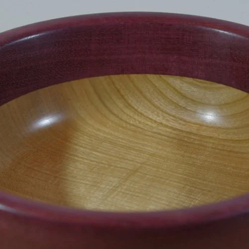 Close-up of a wooden bowl Cherry and purple heart.