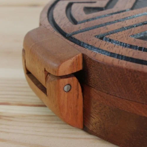 Close-up of a wooden jewellery box with a handmade wooden hinge.