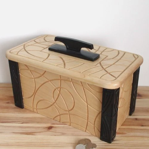 A wooden keepsake box with a handle on top and black decorative legs.