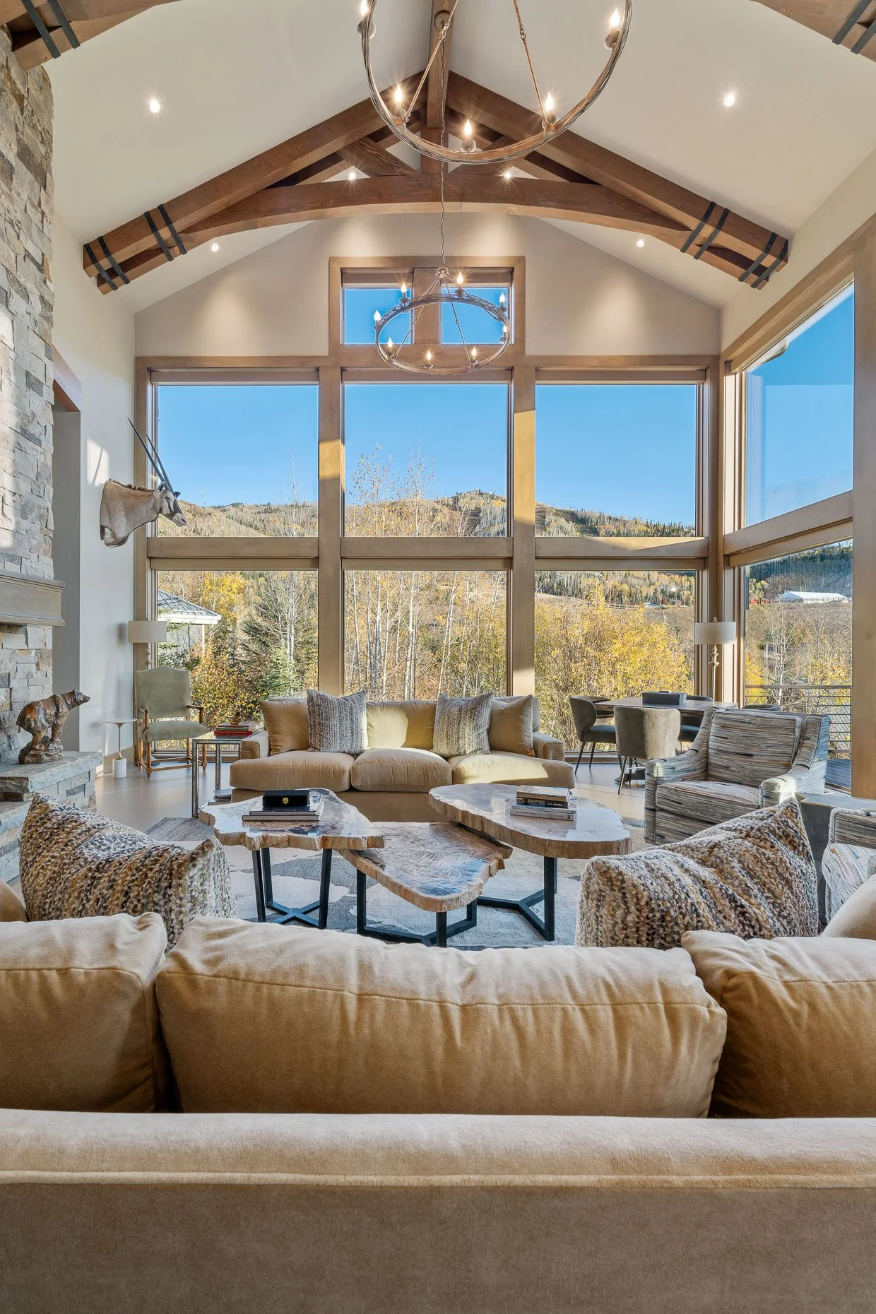 Mountain home with views of ski slopes, wood beams and neutral furniture