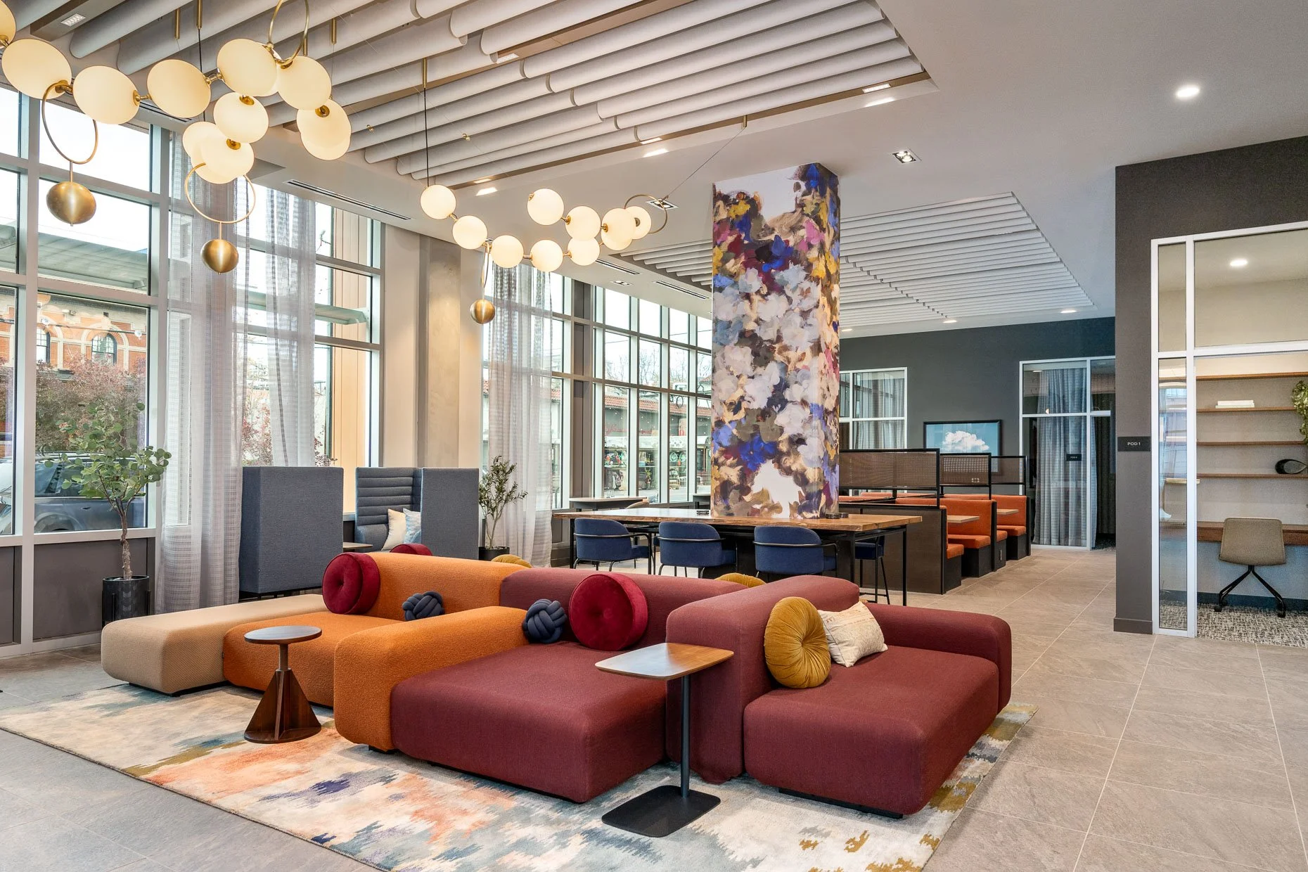 Jewell tones in a collaborative co-op space. Globe lighting, lounge area, bar area, office spaces and intimate personal spaces.