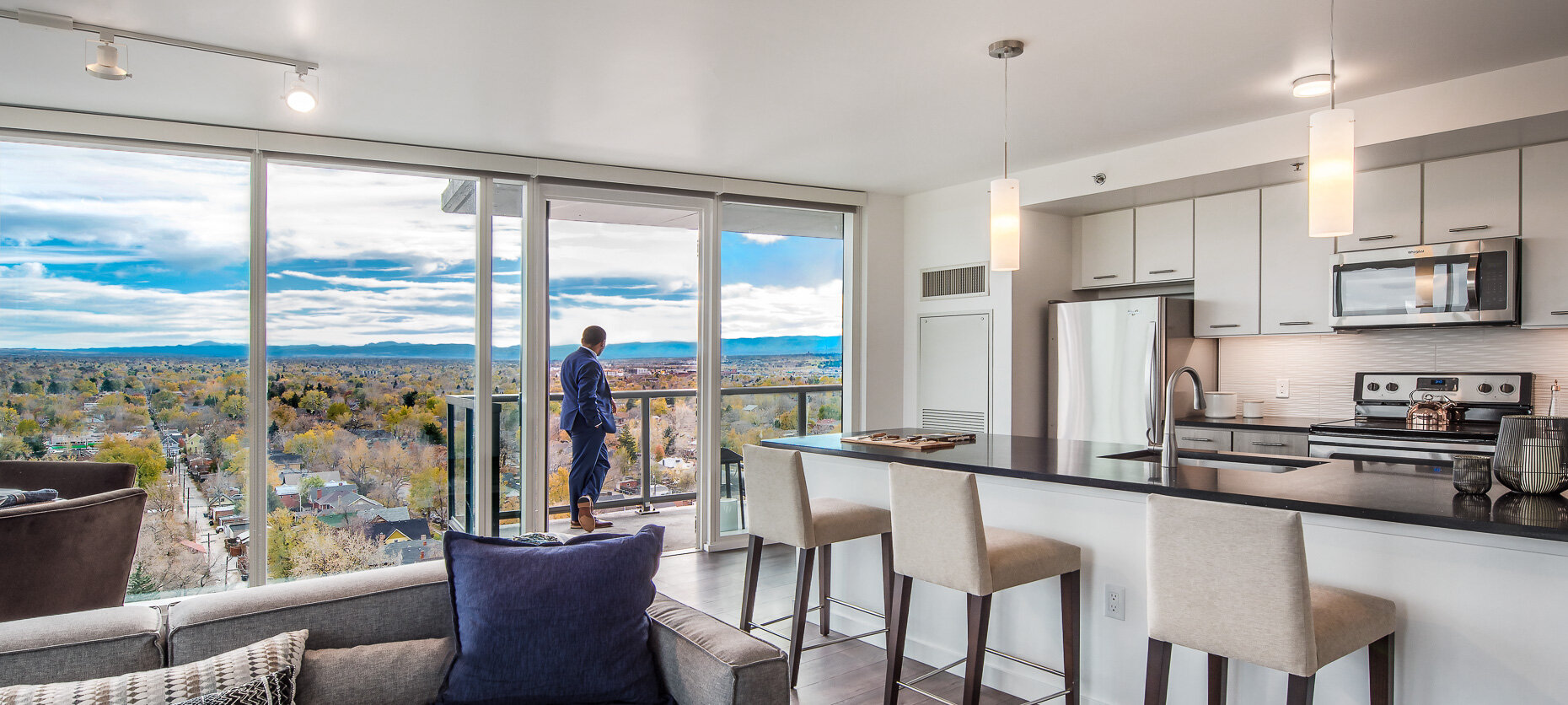 Broe Real Estate, Country Club Towers model with person looking at view