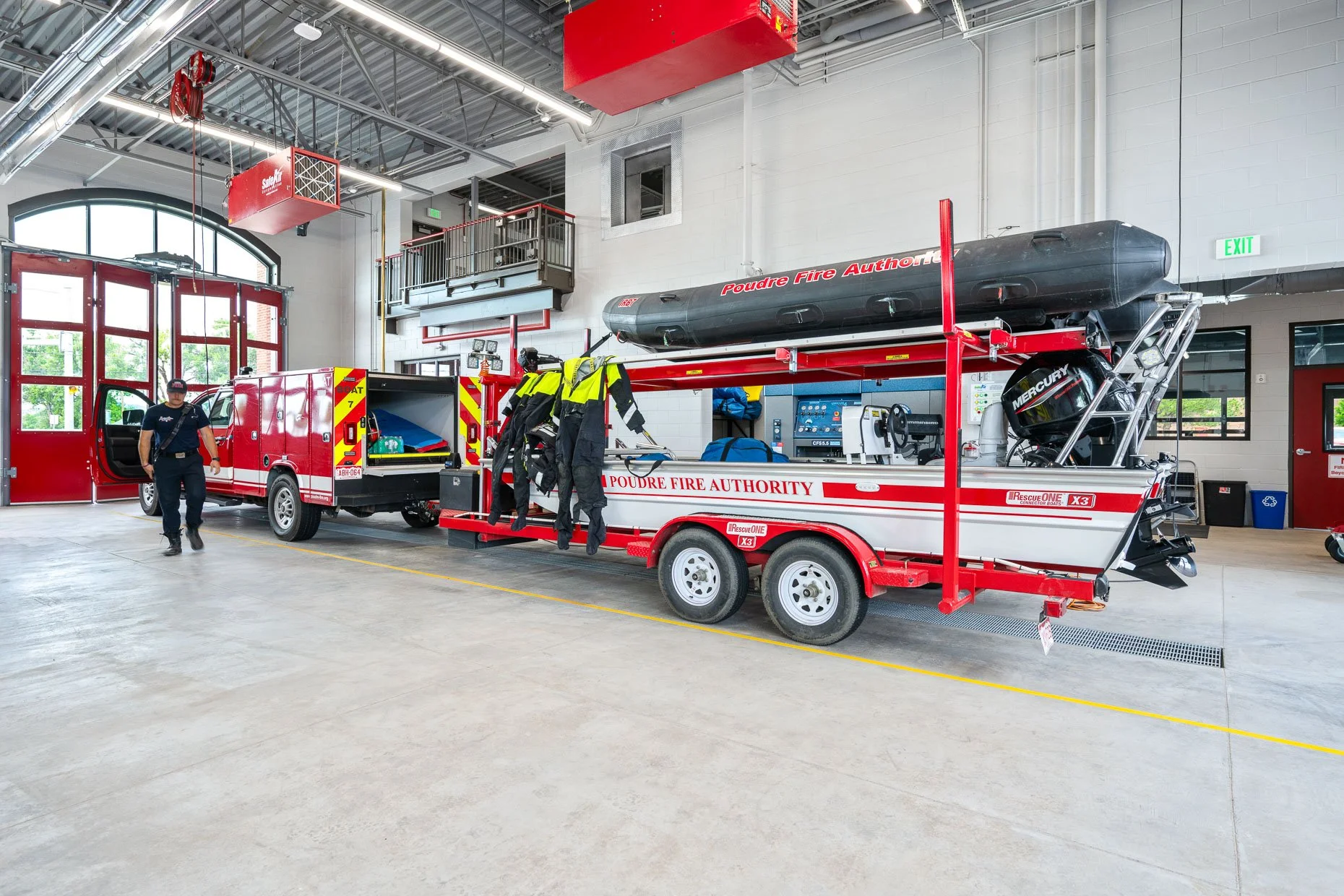 Interior of Fire Station bays with firemen