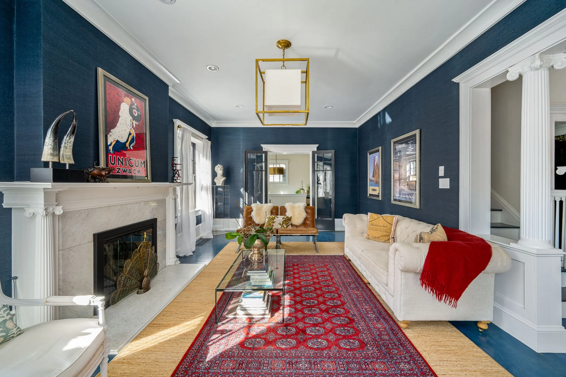 Blue floors and blue walls accented with white trim and pillars in this historic home. (Copy)