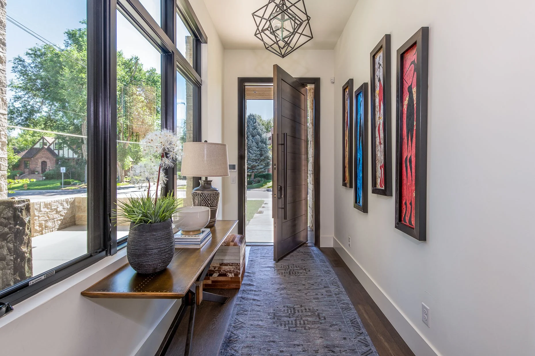 Gorgeous Foyer with enormous wood door and wall of windows