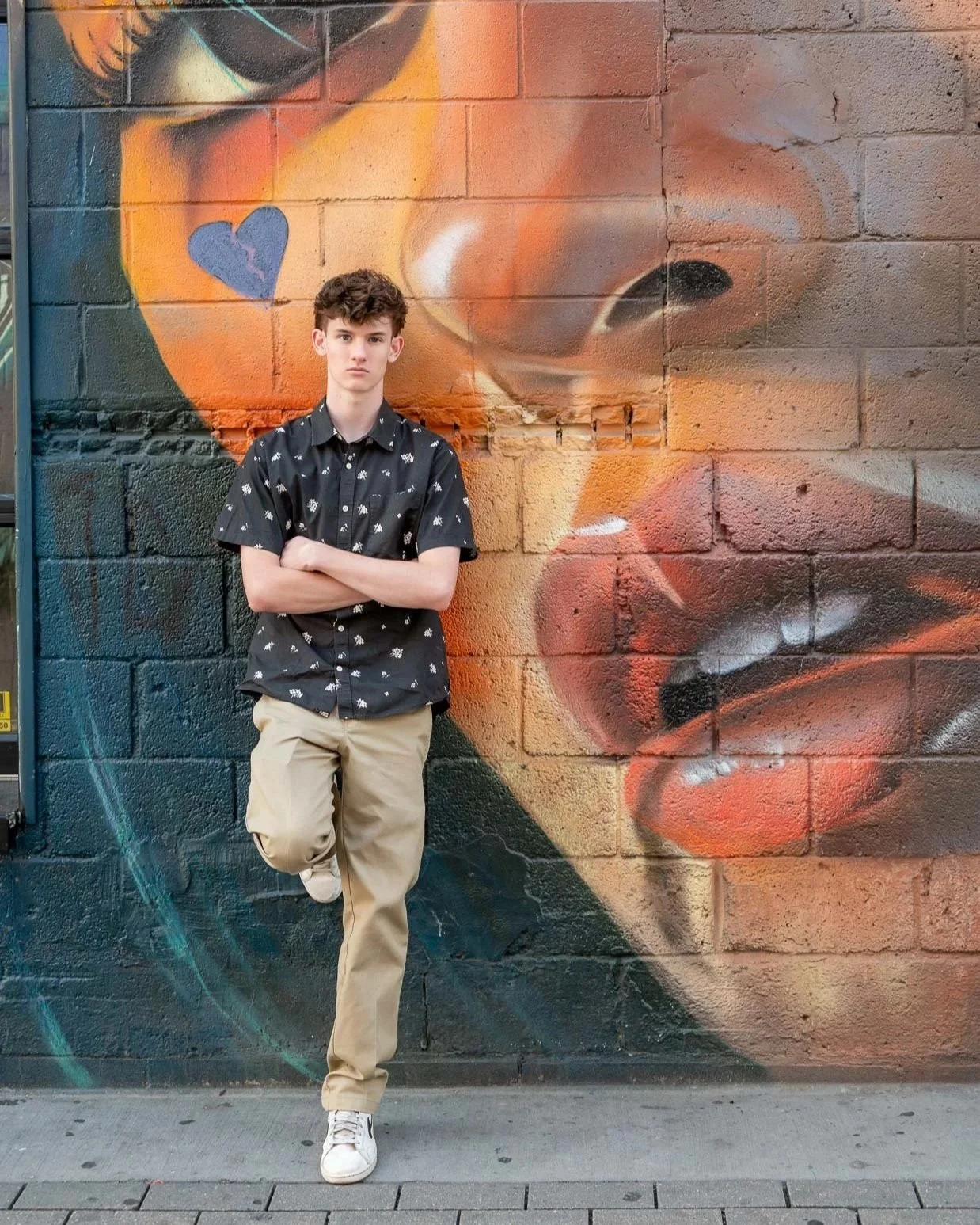 Kade, High School Senior next to Graffiti