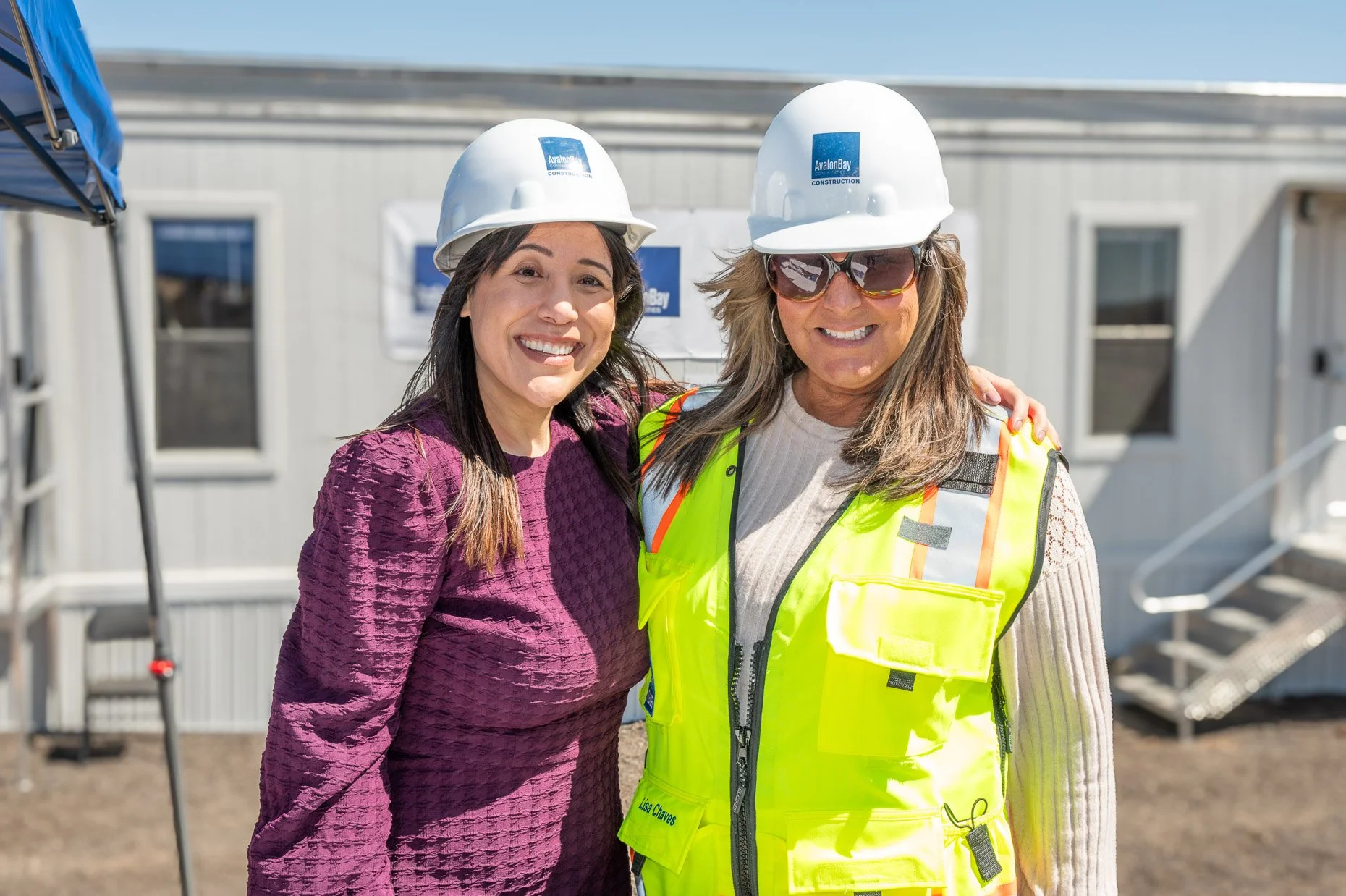 Avalon executives with hardhats on