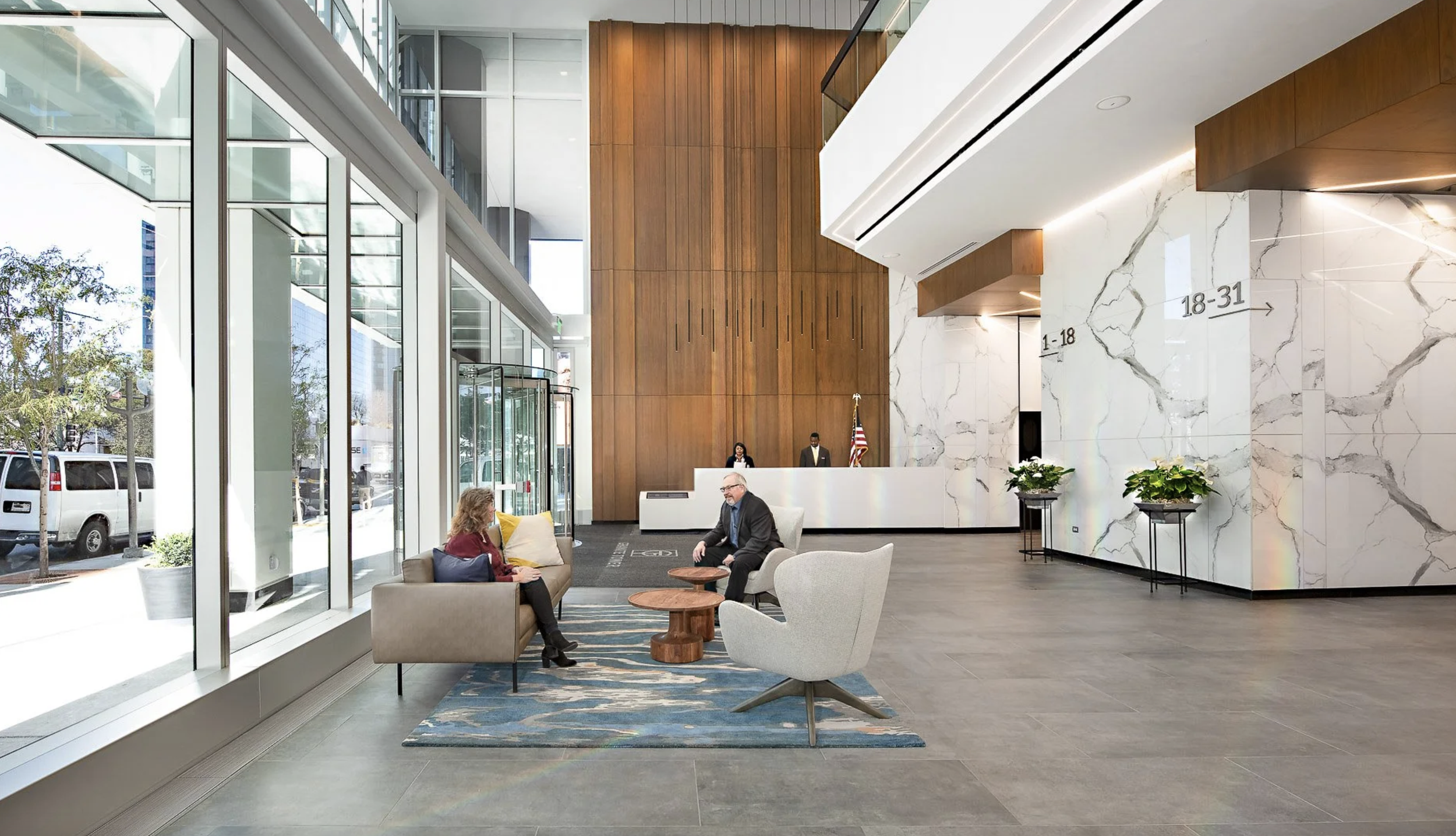 People in commercial office building lobby