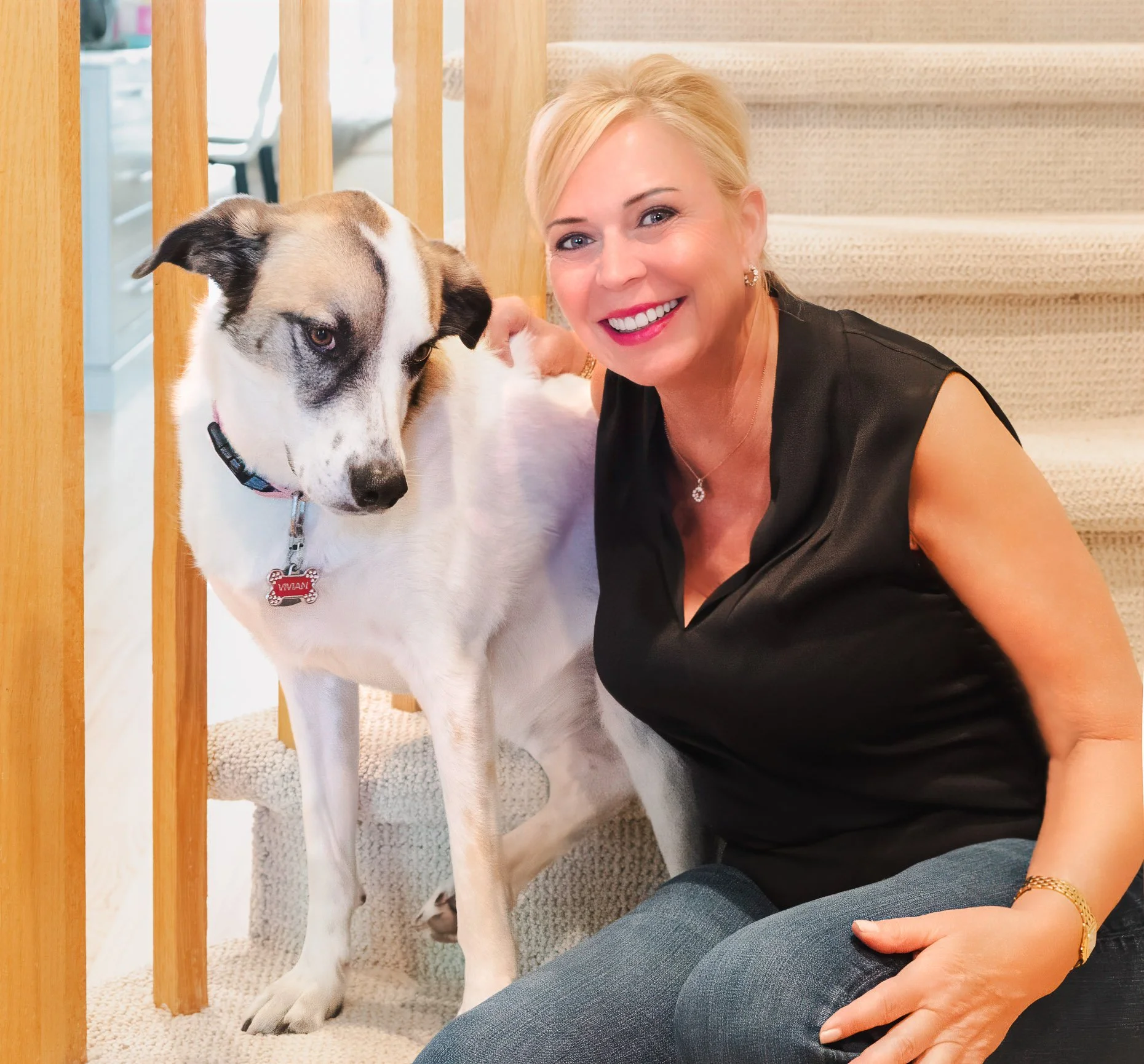 Woman and dog on staircase