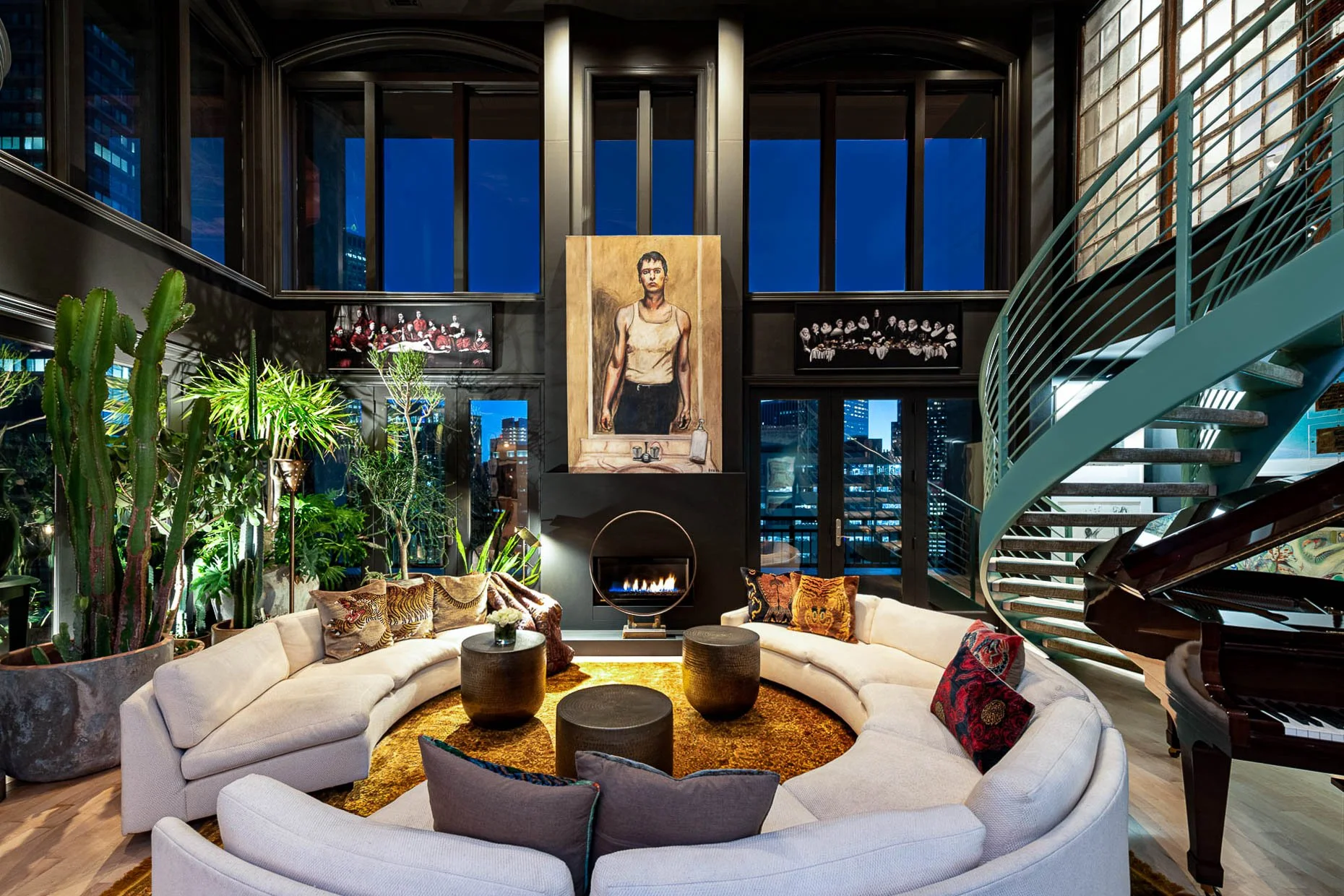 Downtown Denver condo living room with open staircase, walls of windows and circular couch