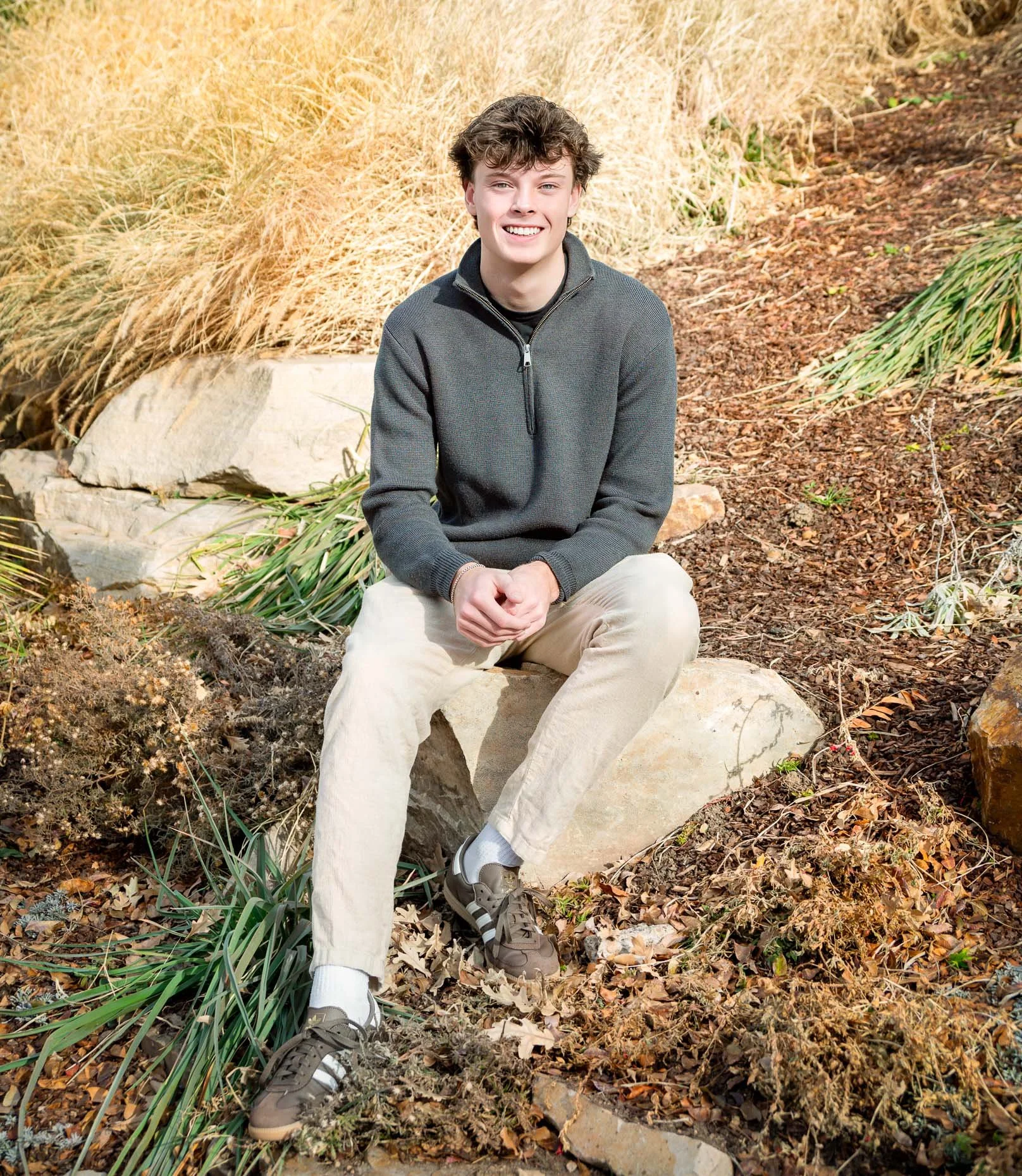 Senior sitting on a rock