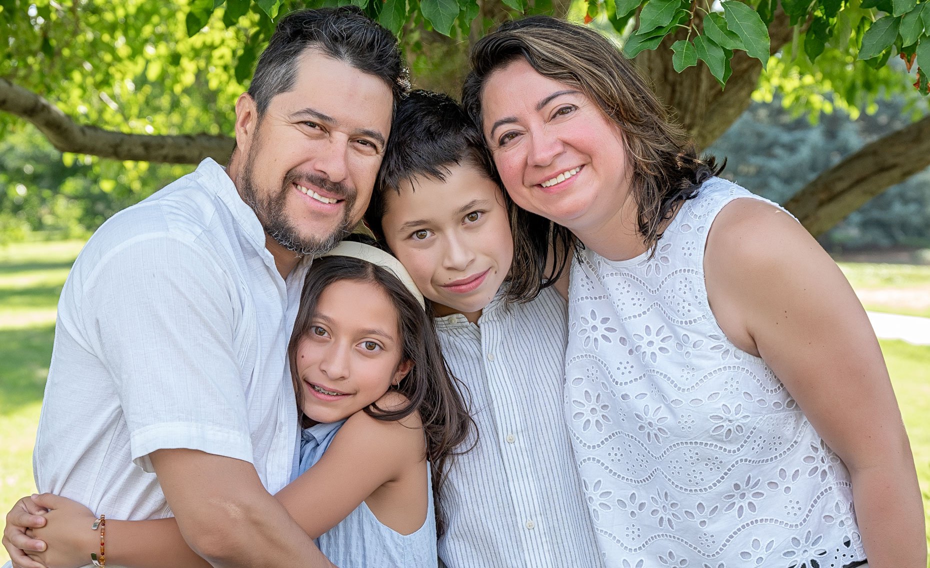 Family outside with two parents and two kids