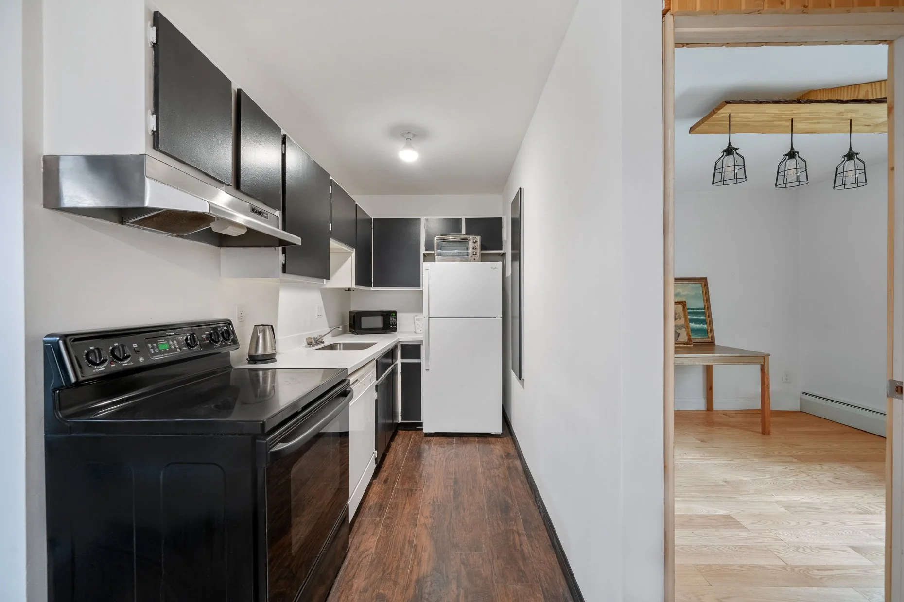 Condo kitchen and front room