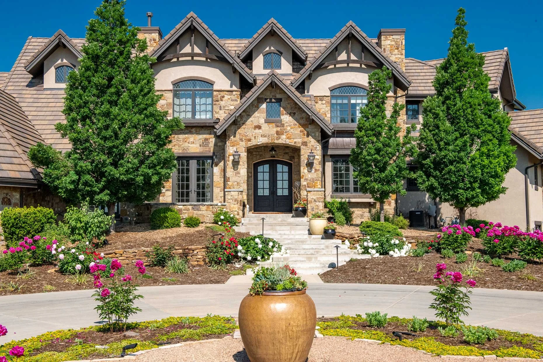 Exterior of mansion in Broomfield, CO with mature landscaping