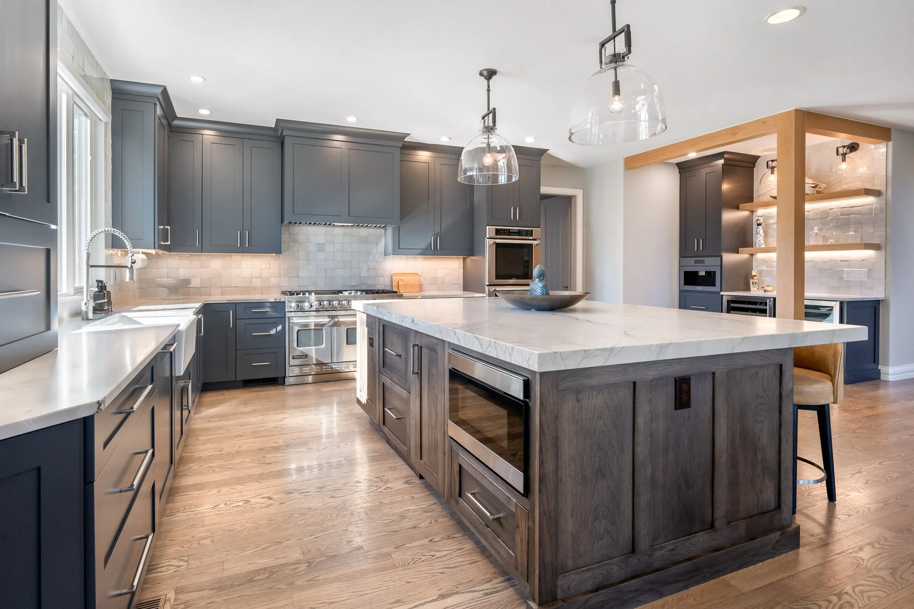 Exceptional kitchen design with spacious center island and separate bar area