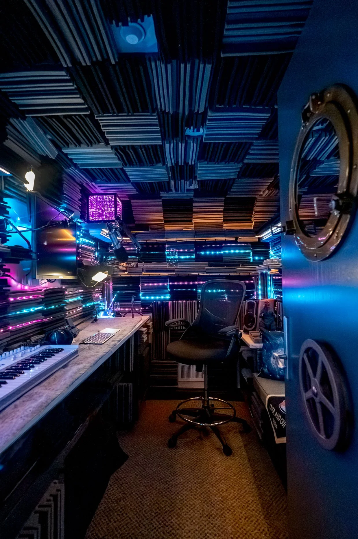 Sound studio with black light accents, and submarine design
