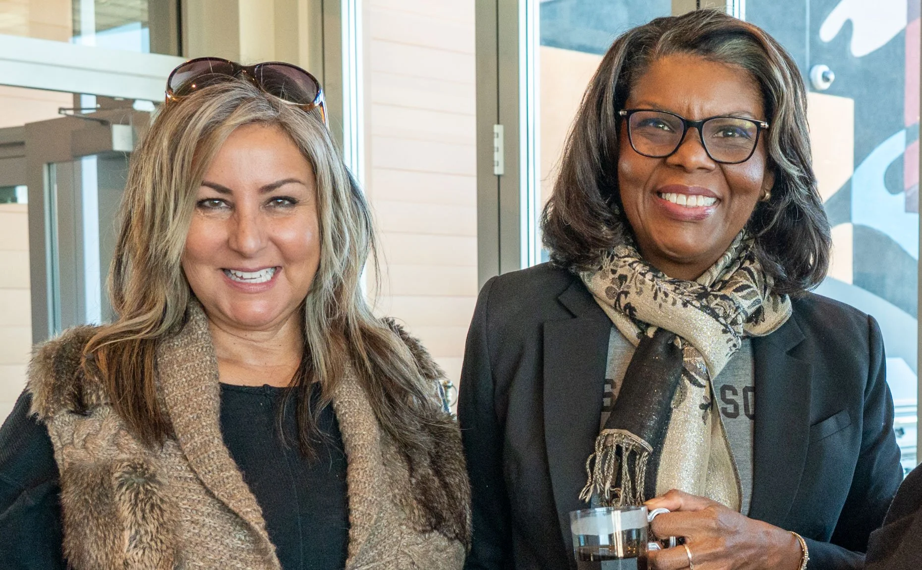 Women at ribbon cutting event