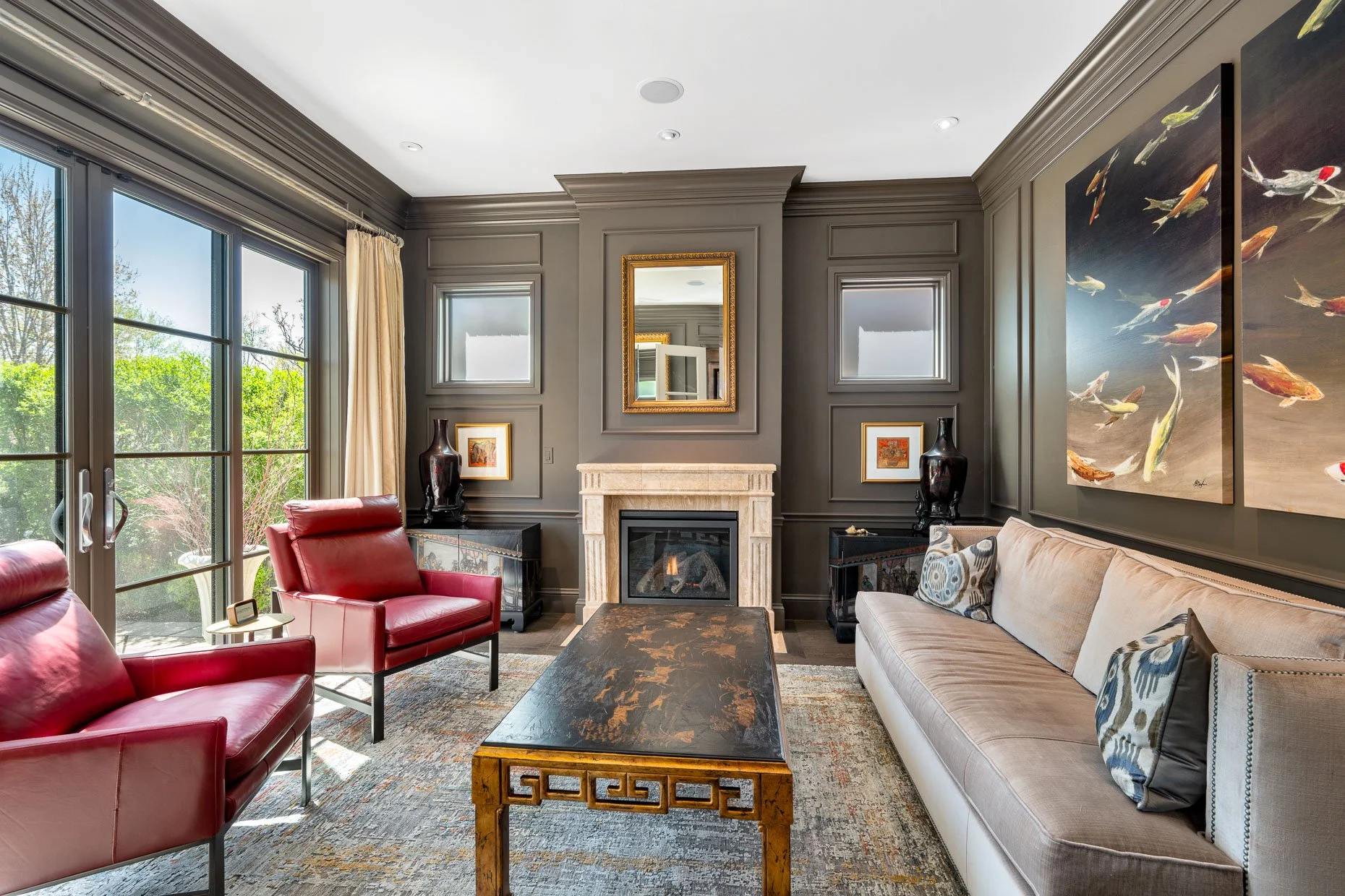 Living Room with dark tan walls, fireplace, patio doors and custom furniture