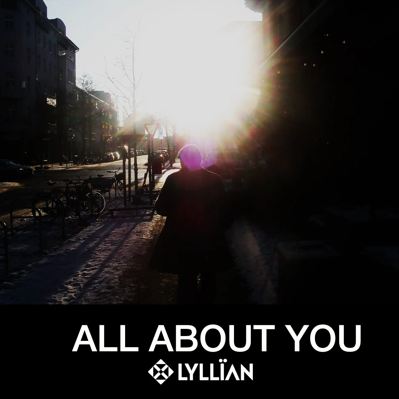 A person walking on a sidewalk in a city street during sunset or sunrise, with the sun bright and low in the sky, casting long shadows. Bicycles are parked along the side of the street, and buildings line the street.