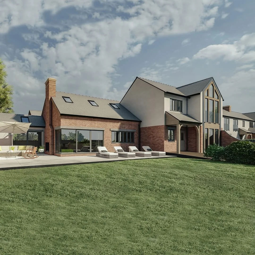 Modern two-story house with brick and white siding exterior, large windows, patio with lounge chairs, green lawn, and outdoor seating, under a partly cloudy sky.