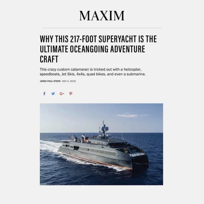 Article headline about a 217-foot superyacht with a photo of a large gray yacht traveling on the open ocean.