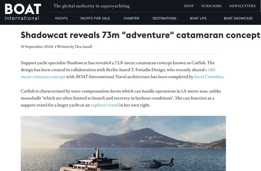 A yacht on the water with a catamaran design, featuring a helicopter parked nearby, with a mountainous island in the background under partly cloudy skies.