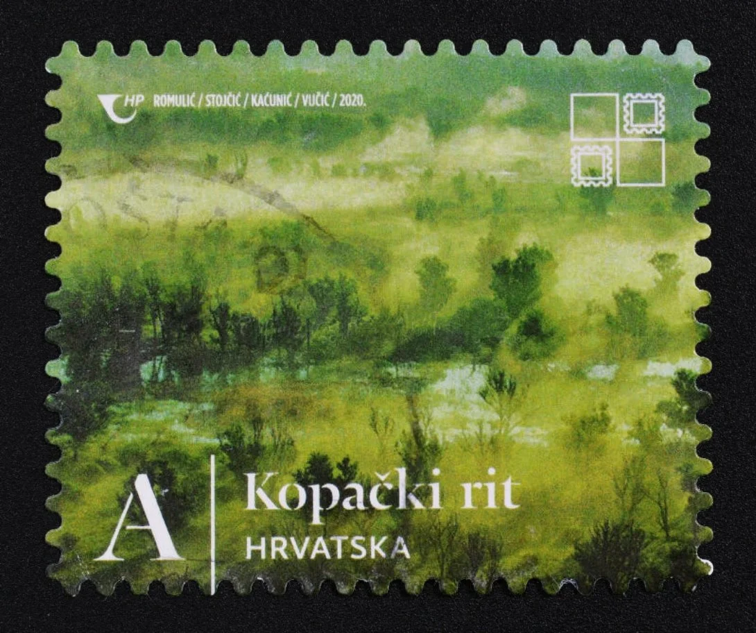 Croatian postage stamp featuring a green landscape with trees and water, marked with denomination A and text 'Kopački rit HRVATSKA'.