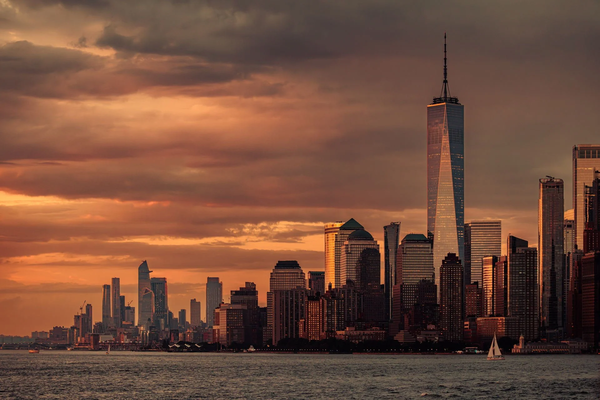 Sunset over the Manhattan skyline featuring One World Trade Center