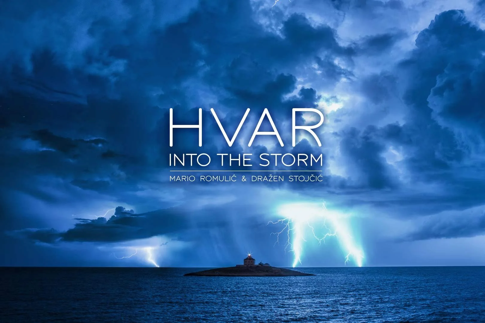 Lightning storm over the ocean with dark clouds and a small island with a lighthouse in the distance, with title text 'HVAR INTO THE STORM' and authors' names Mario Romulić & Dražen Stojčić.