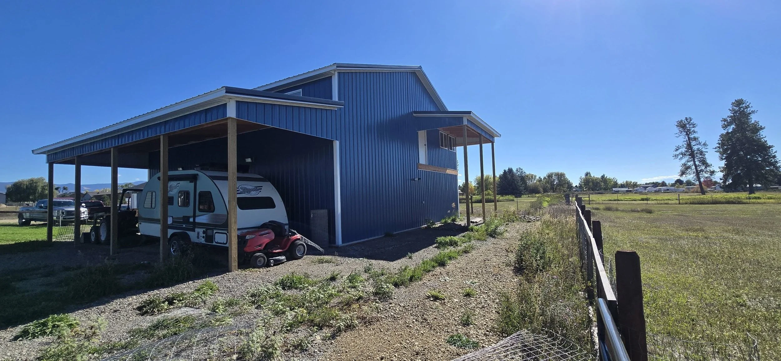 Blue metal house with a large overhang