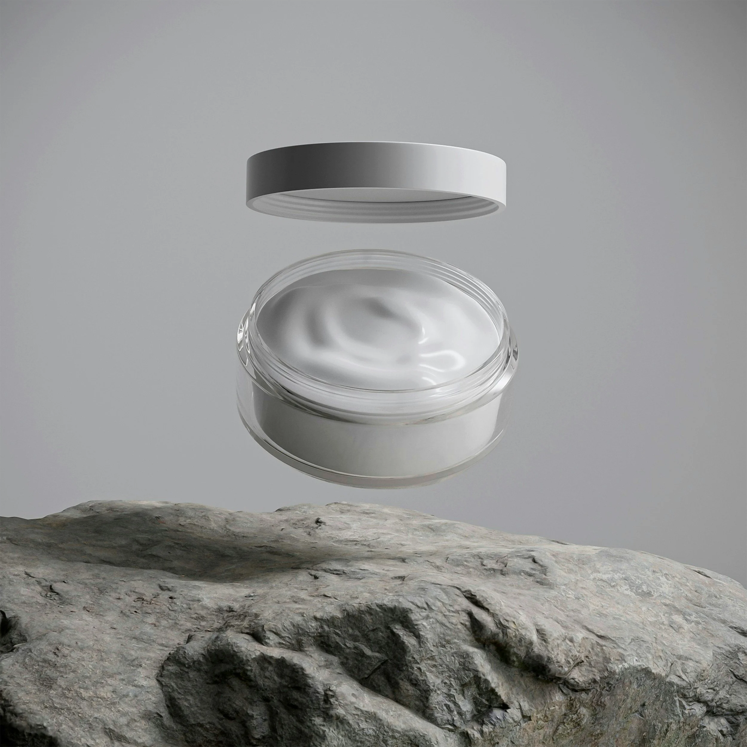 A closed cosmetic jar with white cream inside, floating above a textured rock surface against a gray background.