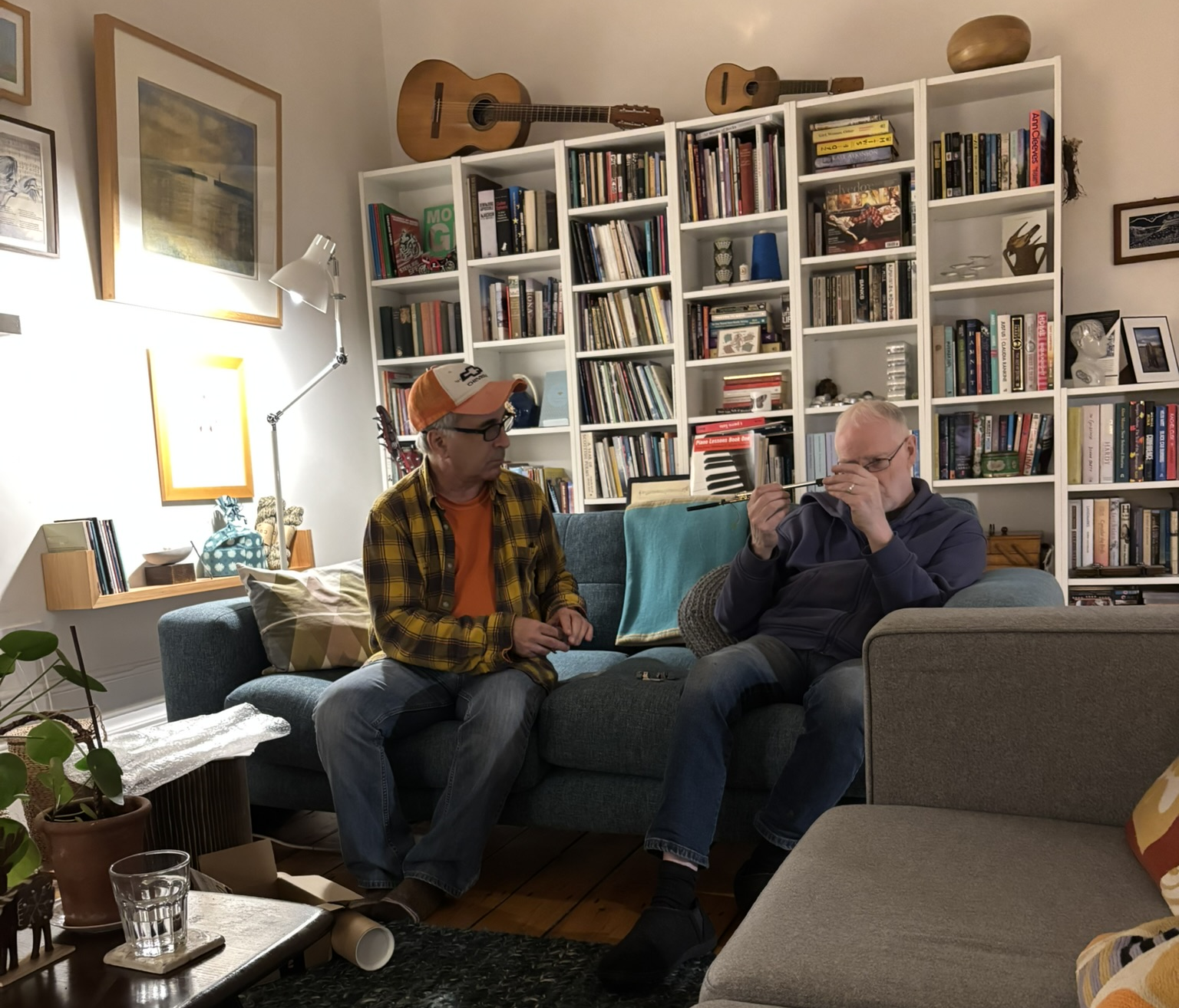Greg Viggiano (left) and John Gordon discuss the prototype and alignment considerations at his home, Glasgow, Scotland, December 3, 2025
