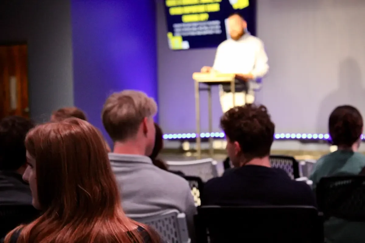 Pastor sharing information with the church about events, registration links, and more