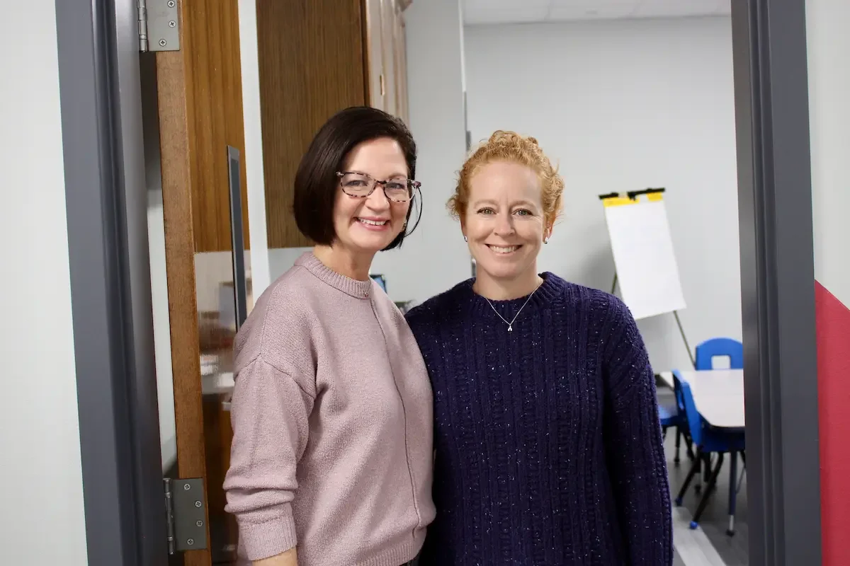 Women smiling ready to explain ministries for different age groups and topics
