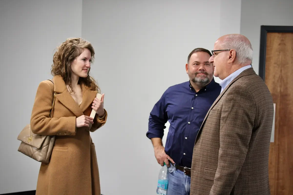 People being welcomed into church on a Sunday morning by the pastor