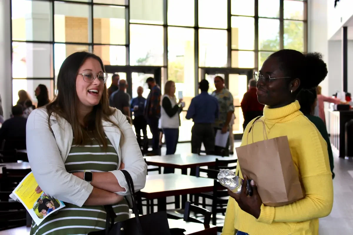Women talking on a Sunday morning visiting for the first time