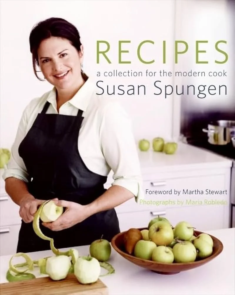 Book cover titled 'RECIPES' by Susan Spungen, featuring a woman (author Susan Spungen) peeling an apple in a kitchen with a bowl of apples and green apples on the counter.