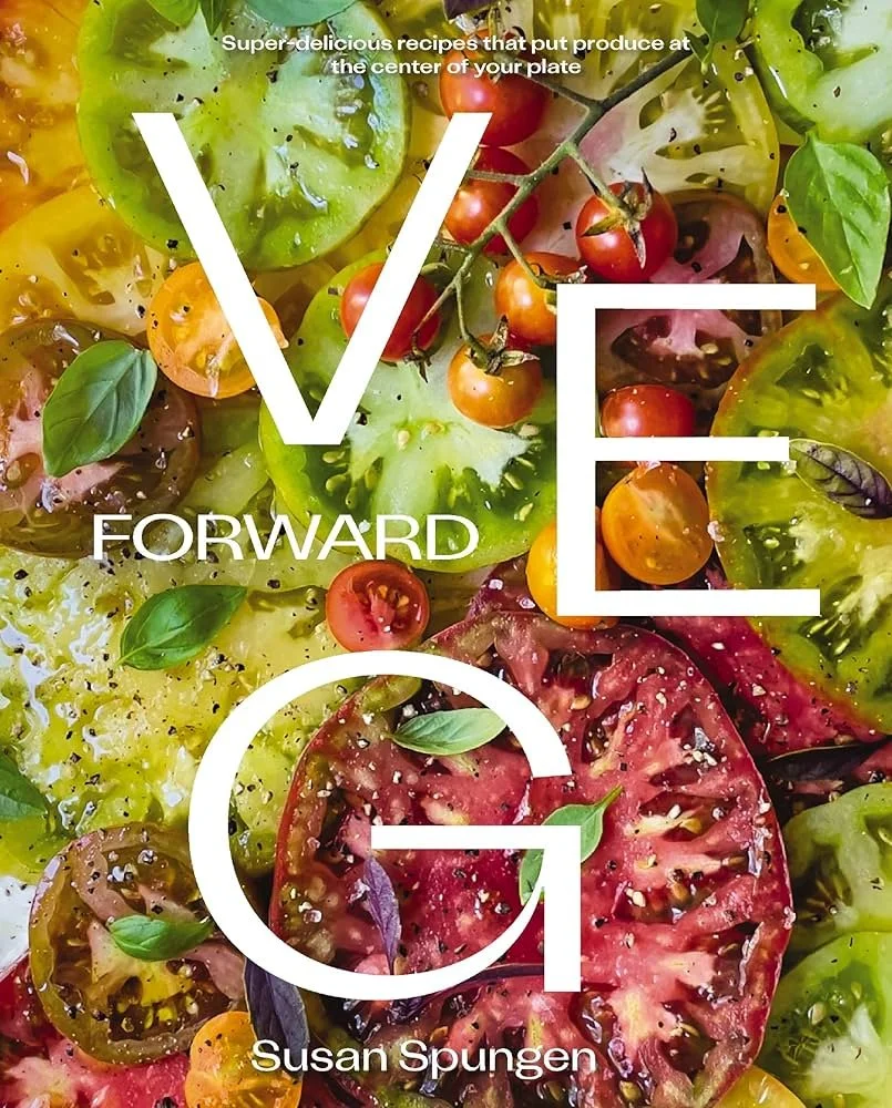 Cover of a book titled 'Veg Forward' by Susan Spungen, featuring an overhead photo of halved heirloom tomatoes in various colors, basil leaves, and black pepper.