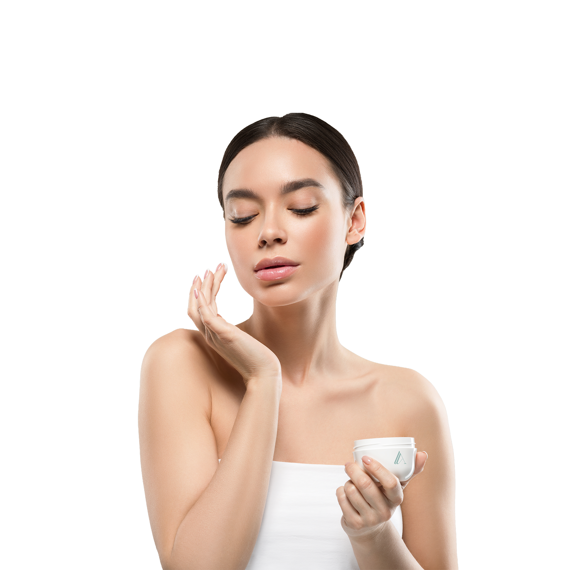 A woman with dark hair and light skin holding a white jar of skincare cream, gently applying cream to her face.