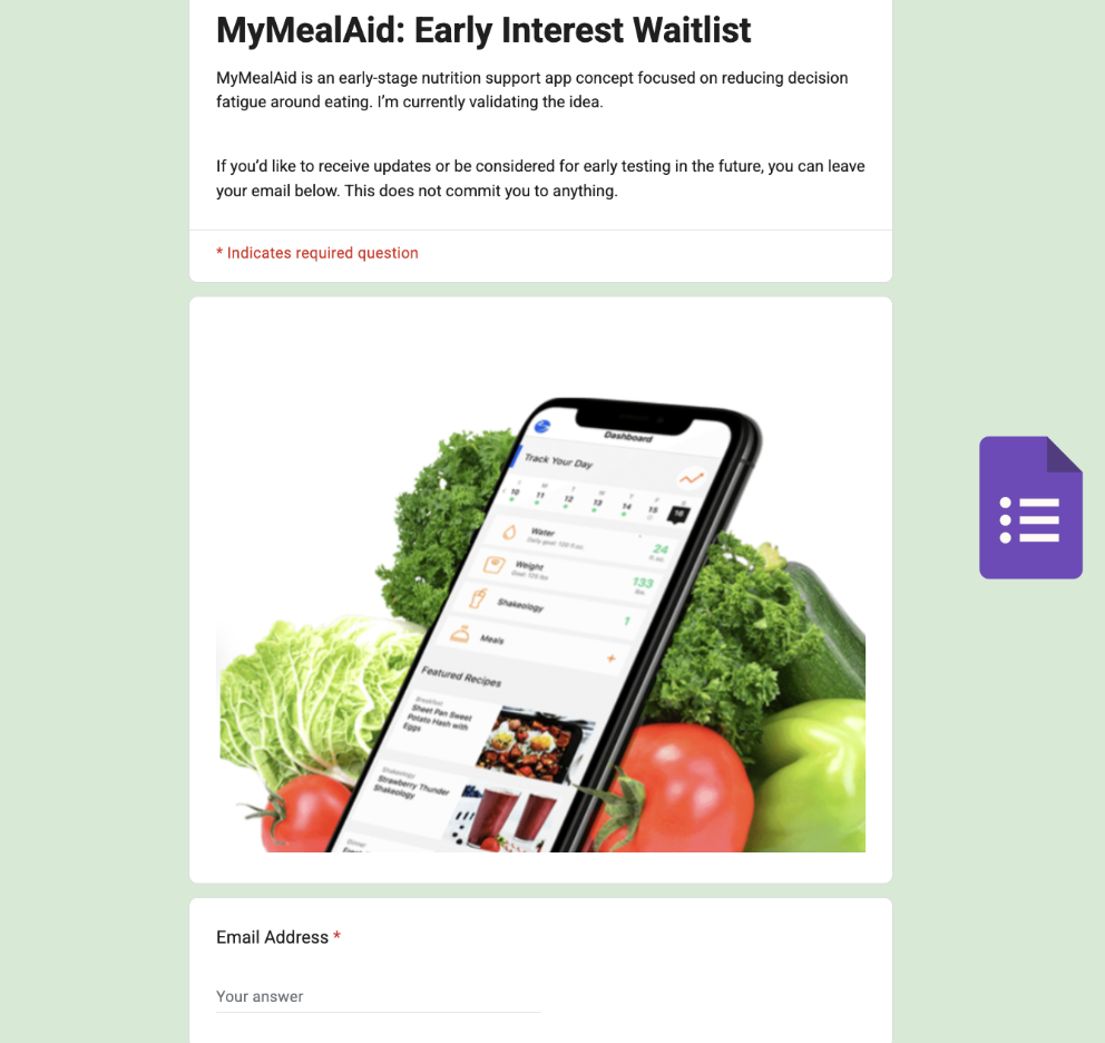 Screenshot of a webpage titled "MyMealAid: Early Interest Waitlist" featuring a smartphone displaying a diet tracking app, surrounded by fresh vegetables including lettuce, tomato, and zucchini.