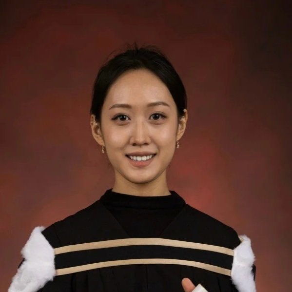 A woman in a black graduation gown with white and beige accents, smiling against a brownish gradient background.