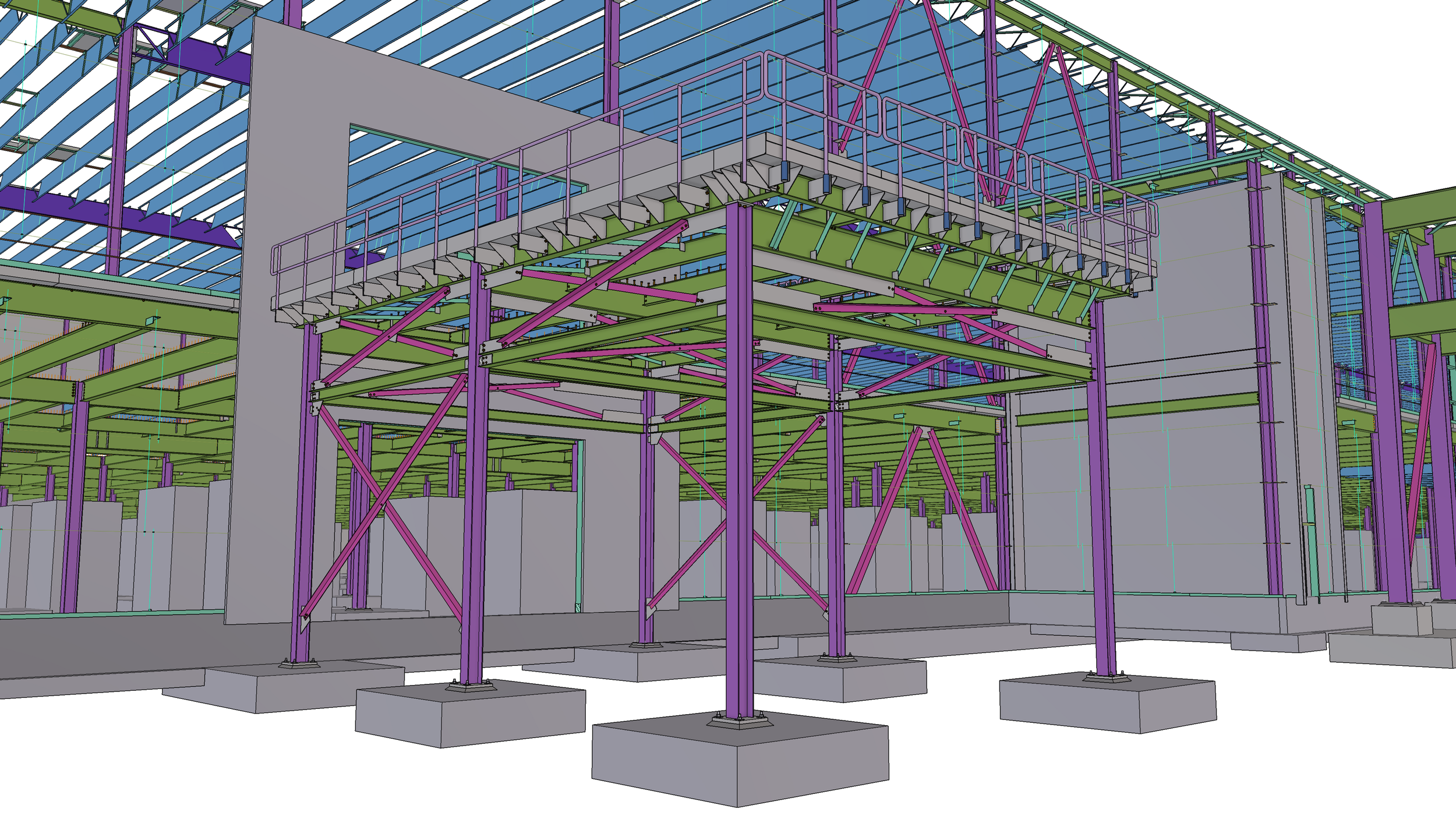 Structural steel framework with purple, green, and gray beams, supported by concrete footings, under construction inside a building.
