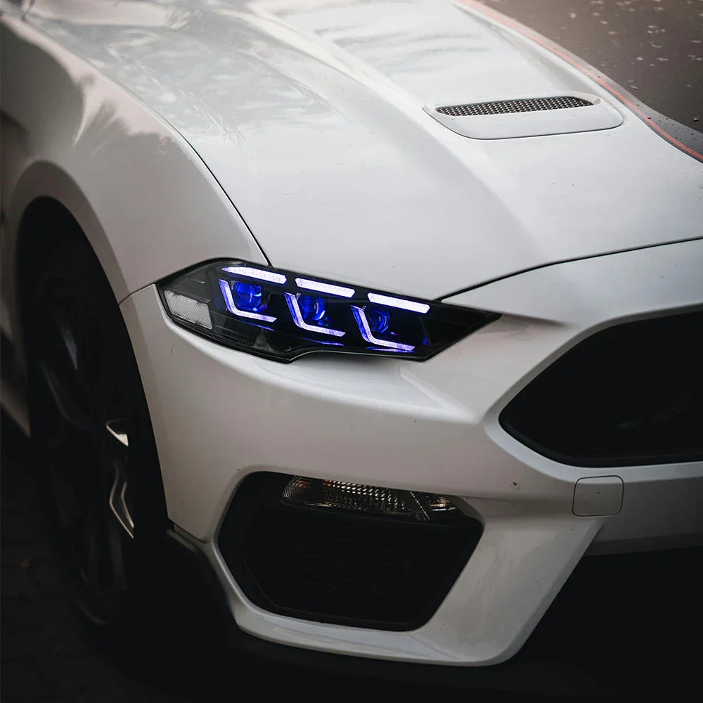 white mustang blue lights.webp