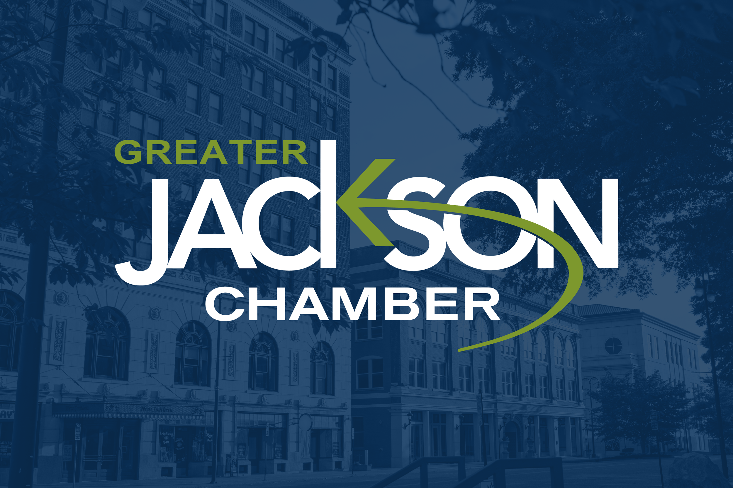 Logo of Greater Jackson Chamber with an urban building and trees in the background.