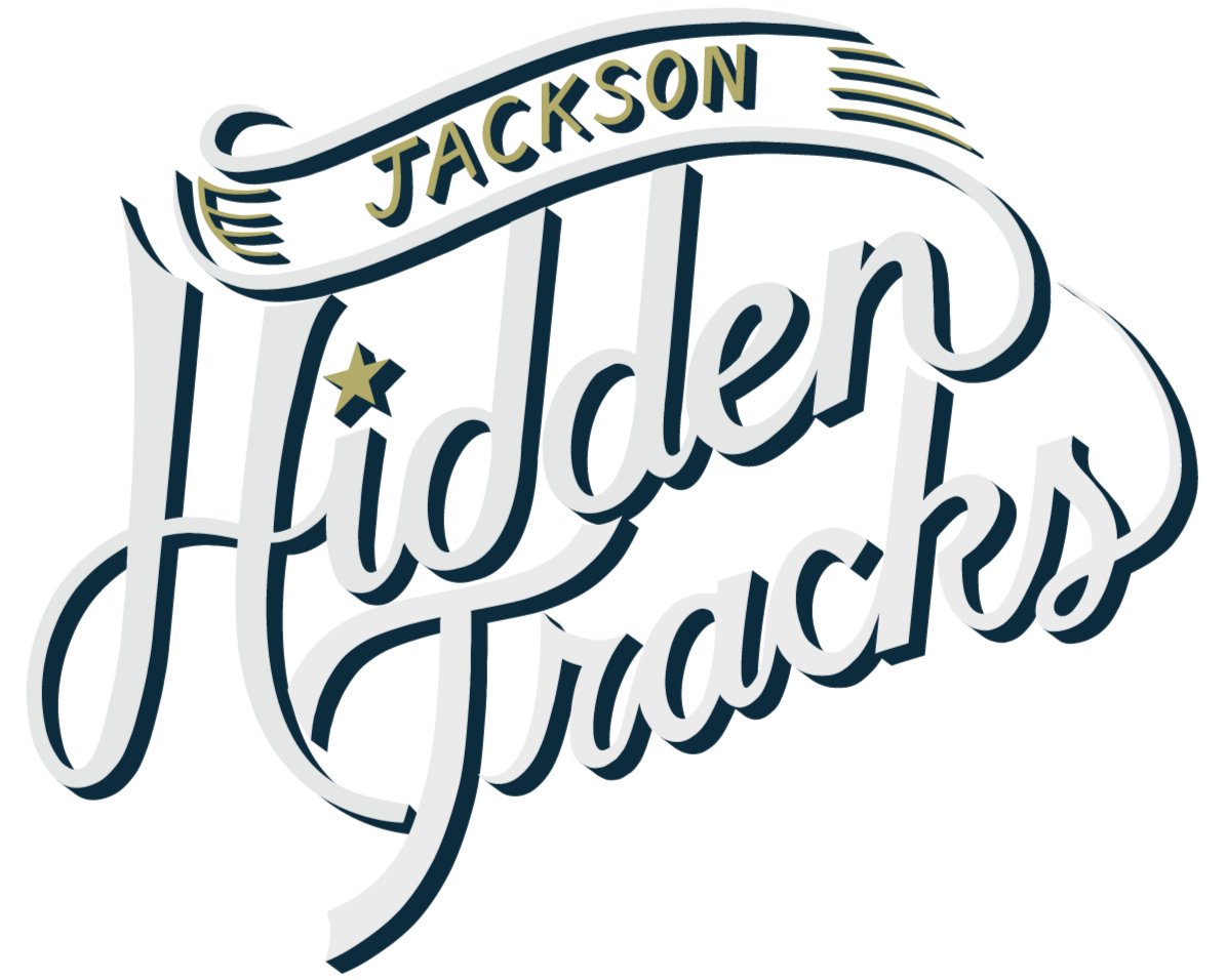 Jackson Hidden Tracks logo in stylized script with a star and decorative elements.