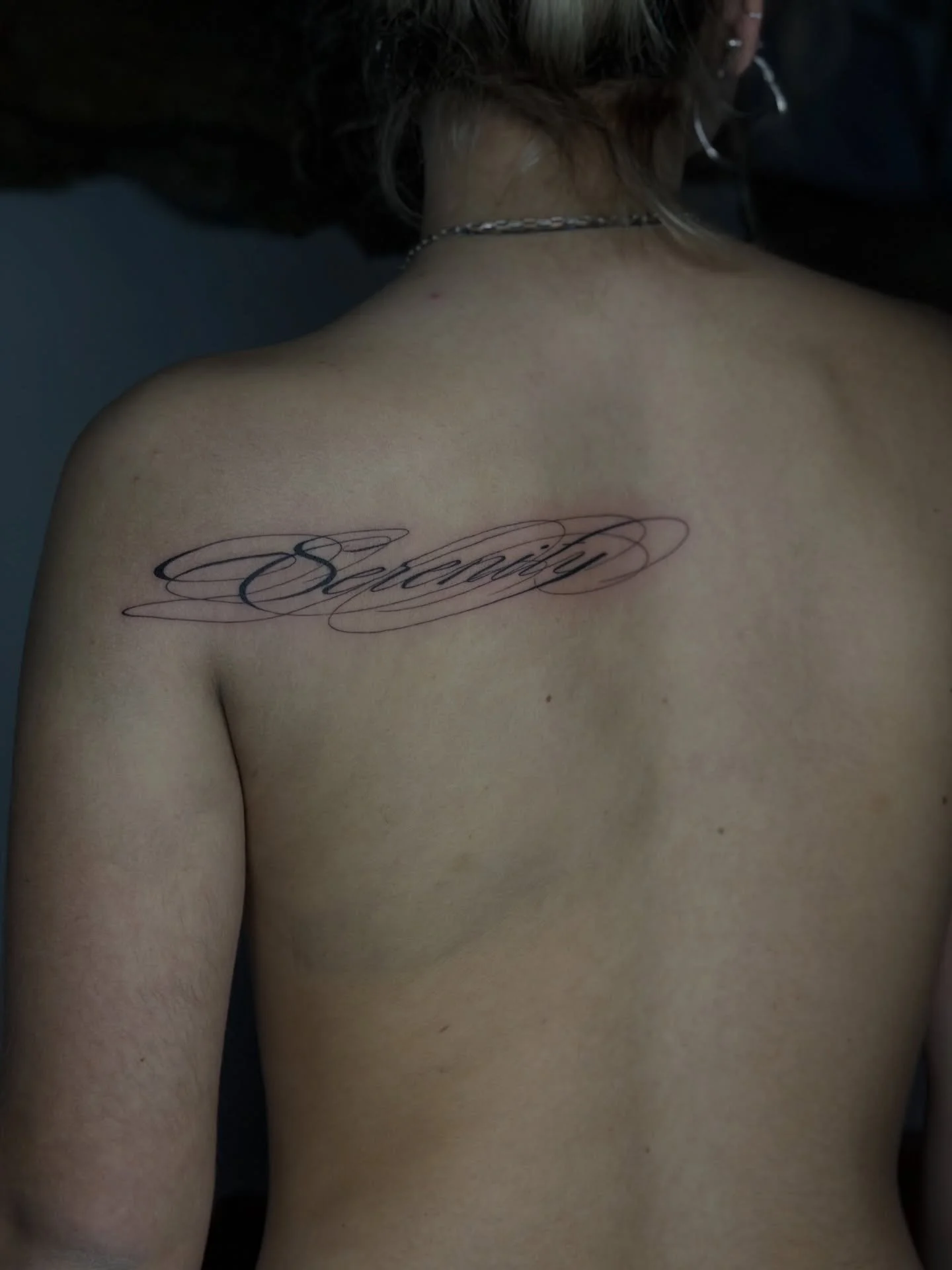 Serenity &mdash; written in flowing calligraphy, bold in scale yet soft in feeling.
A word that carries calm, trust, and quiet strength, shaped to move naturally with the body.

Some words don&rsquo;t just sit on the skin &mdash; they settle into you